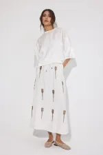 JUPE À PERLES AVEC TAILLE ÉLASTIQUE