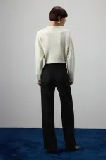 PANTALON EN DAIM À BOUTONS DORÉS