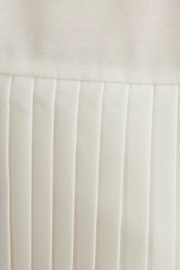 ASYMMETRICAL SHIRT WITH PLEATED DETAILS