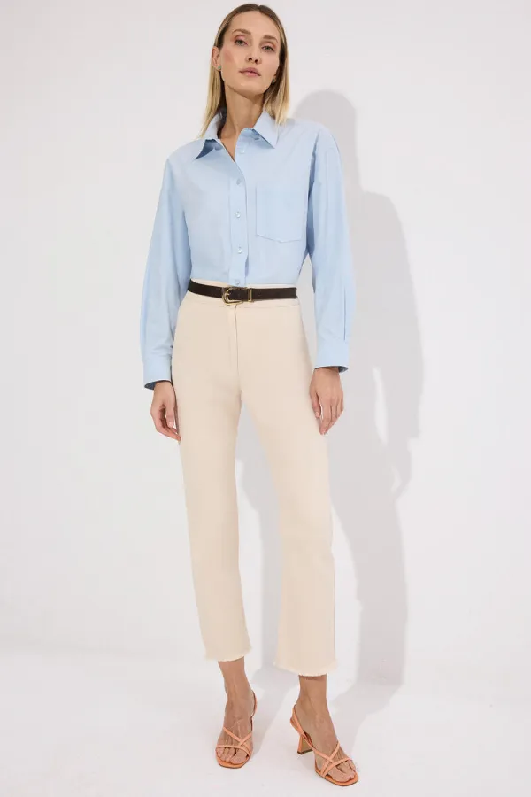 PANTALON EN JEAN À OURLET À FRANGES