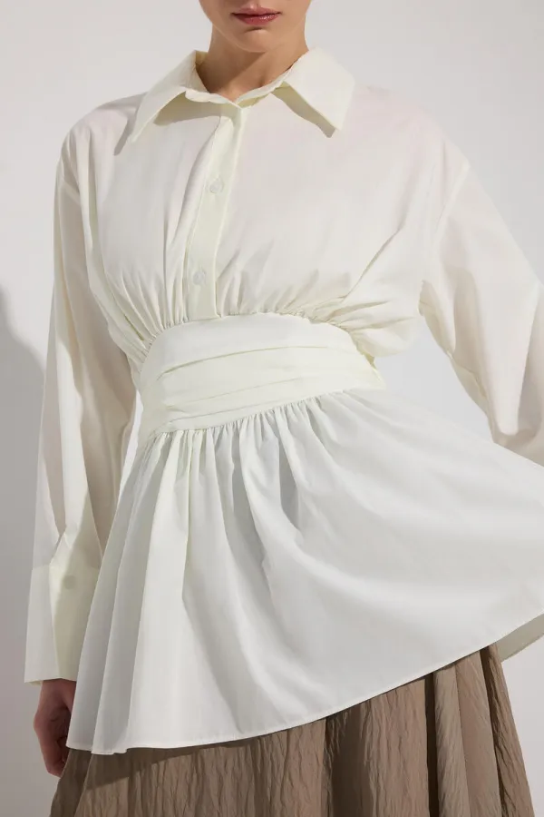 PEPLUM TUNIC WITH CORSET AT THE WAIST