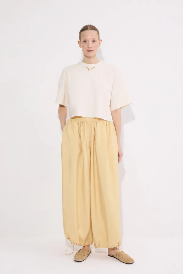 PANTALONS À BONNETS ÉLASTIQUES