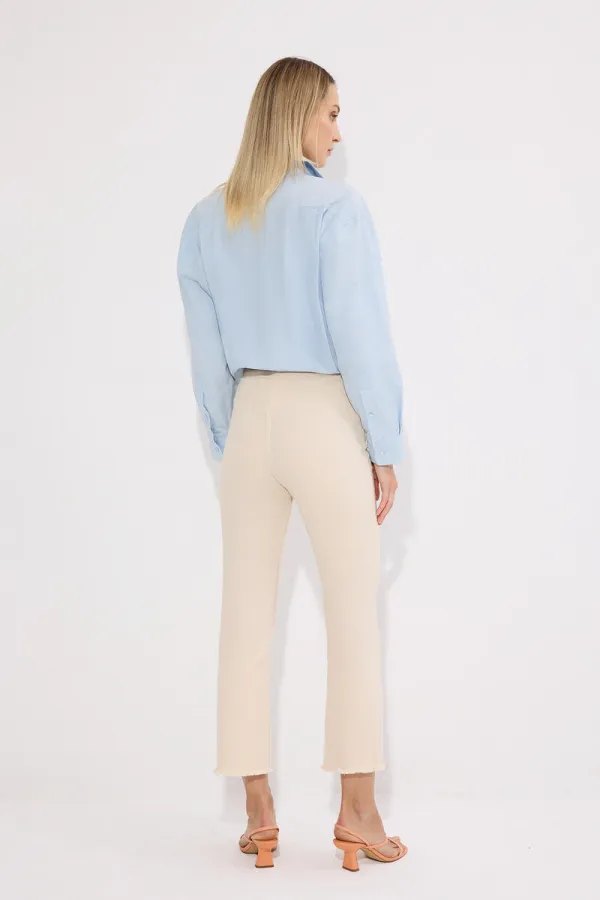 PANTALON EN JEAN À OURLET À FRANGES