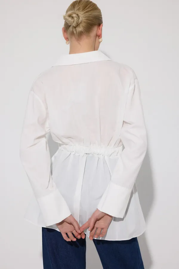 PEPLUM TUNIC WITH CORSET AT THE WAIST