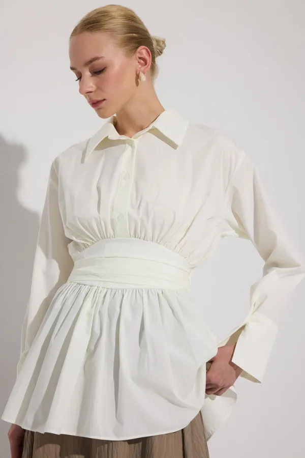 PEPLUM TUNIC WITH CORSET AT THE WAIST