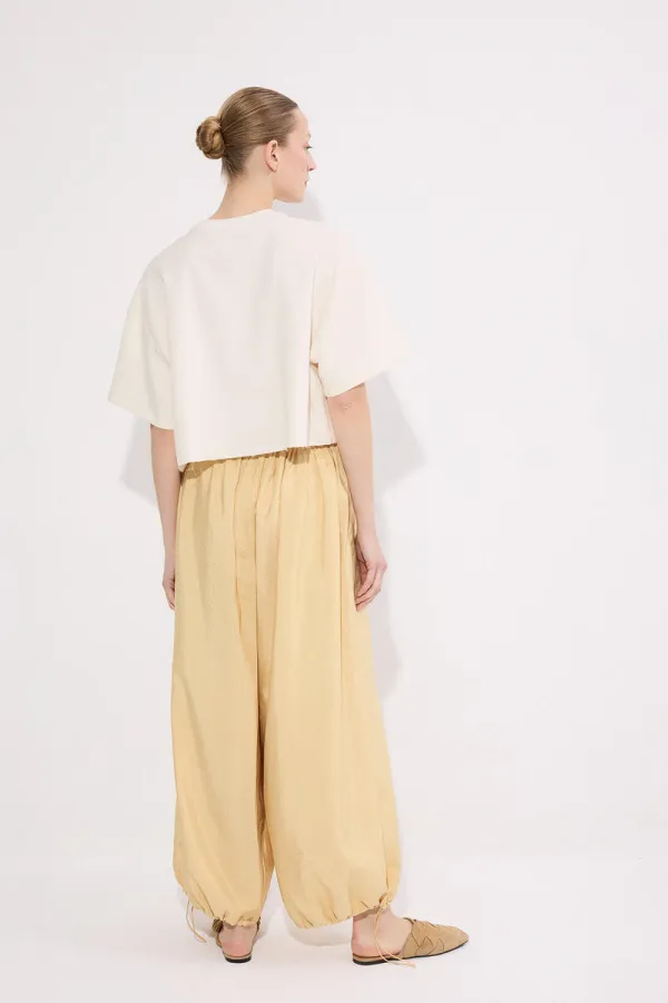 PANTALONS À BONNETS ÉLASTIQUES