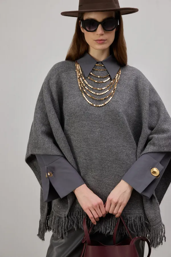 PONCHO EN MAILLE À FRANGES