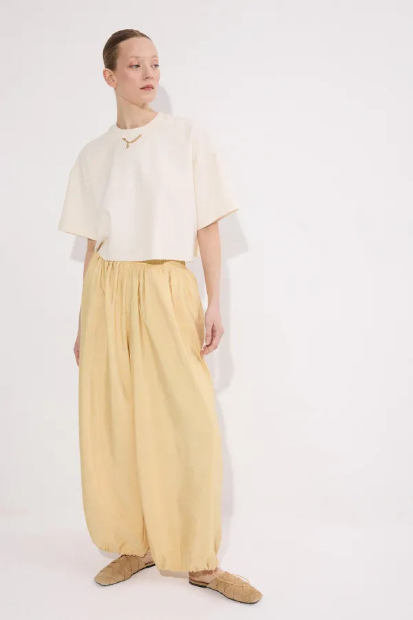 PANTALONS À BONNETS ÉLASTIQUES