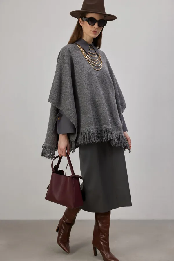 PONCHO EN MAILLE À FRANGES