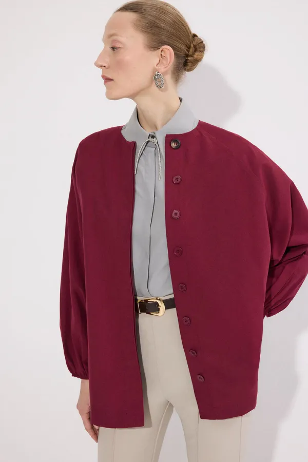 blouson aviateur saisonnier à manches bouffantes et ceinture