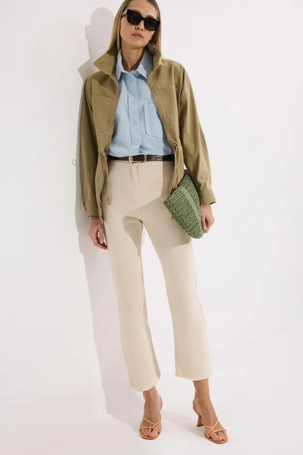 PANTALON EN JEAN À OURLET À FRANGES