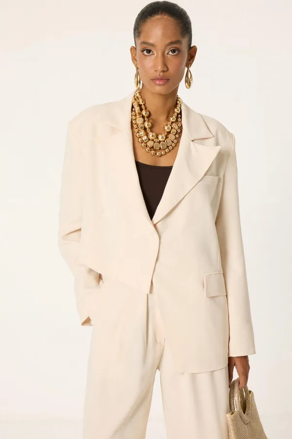 ENSEMBLE VESTE ET PANTALON ASYMÉTRIQUE