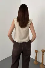 Blouse beige à boutons sur le devant et col bébé, vendue en gros