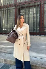 Trench-coat long beige à ceinture en gros