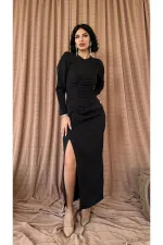 Robe longue noire plissée fendue en gros