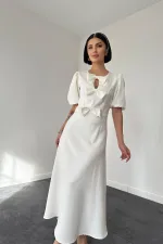 Robe mi-longue blanche à nœud en gros