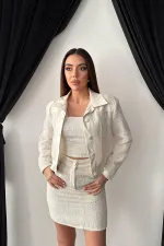 Ensemble veste et pantalon garnis de cuir triple écru en gros