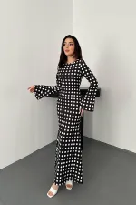 Robe moulante noire à pois en gros