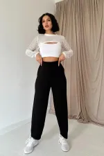 Pantalon noir plissé élastique avec détails en gros