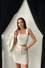 Ensemble veste et pantalon garnis de cuir triple écru en gros