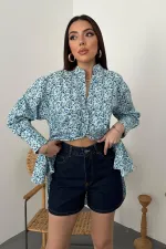 Chemise bleue à col en V et à motifs en gros