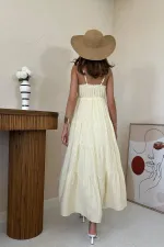 Robe en mousseline rayée jaune à bretelles en gros