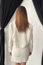 Ensemble veste et pantalon garnis de cuir triple écru en gros