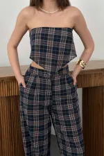 Pantalon bleu marine à ceinture et liens latéraux en gros