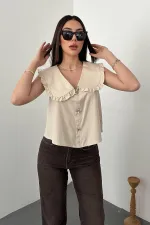 Blouse beige à boutons sur le devant et col bébé, vendue en gros