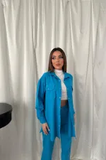 Ensemble chemise bleue et pantalon à pression en gros