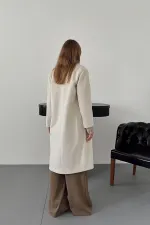 Manteau long écru en gros