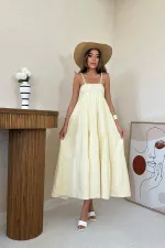 Robe en mousseline rayée jaune à bretelles en gros