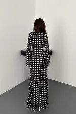 Robe moulante noire à pois en gros
