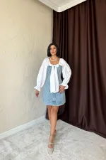 Robe en jean bleue avec nœud sur le devant en gros