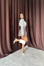 Jupe plissée à boutons fumés en gros