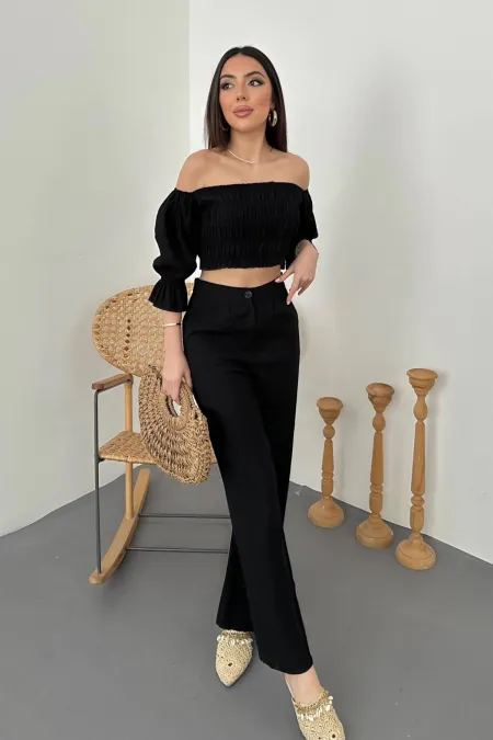 Chemisier à col noir et pantalon noir en vente en gros