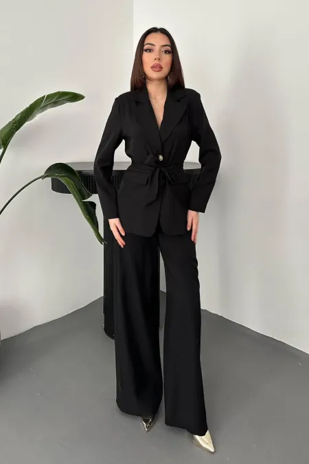 Ensemble veste et pantalon noirs ceinturés en gros
