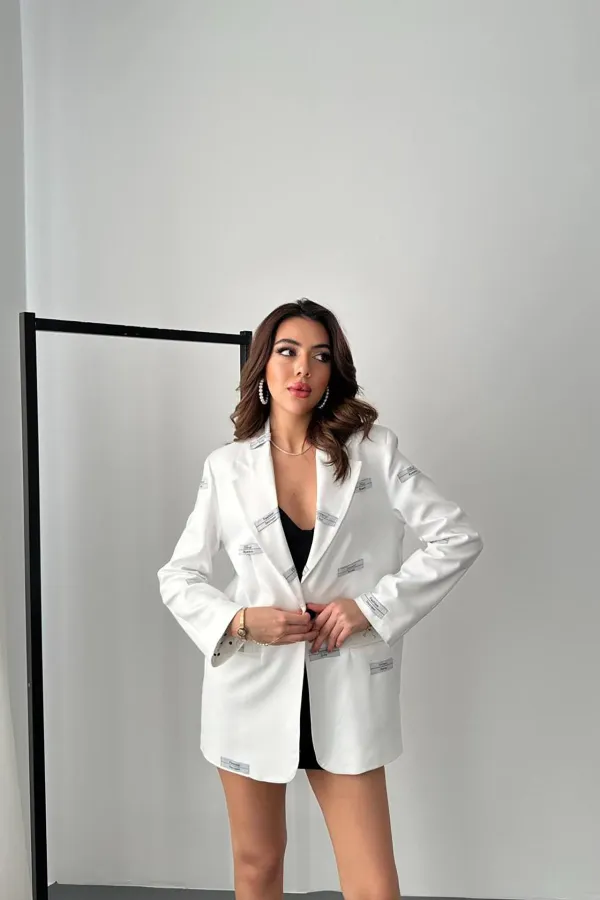 Veste détaillée avec étiquette écrue en gros