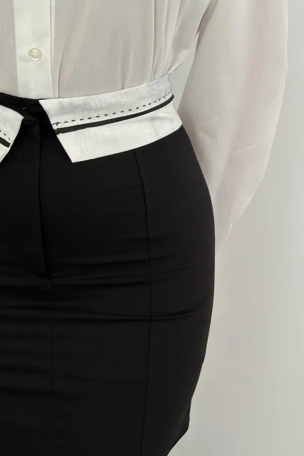 Mini-jupe noire ceinturée en gros