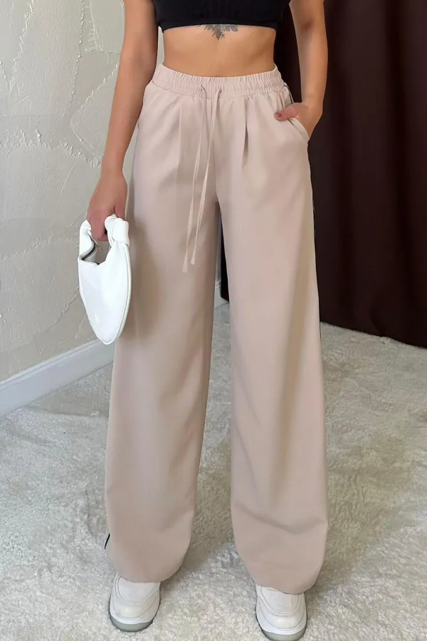 Pantalon beige à rayures latérales en gros