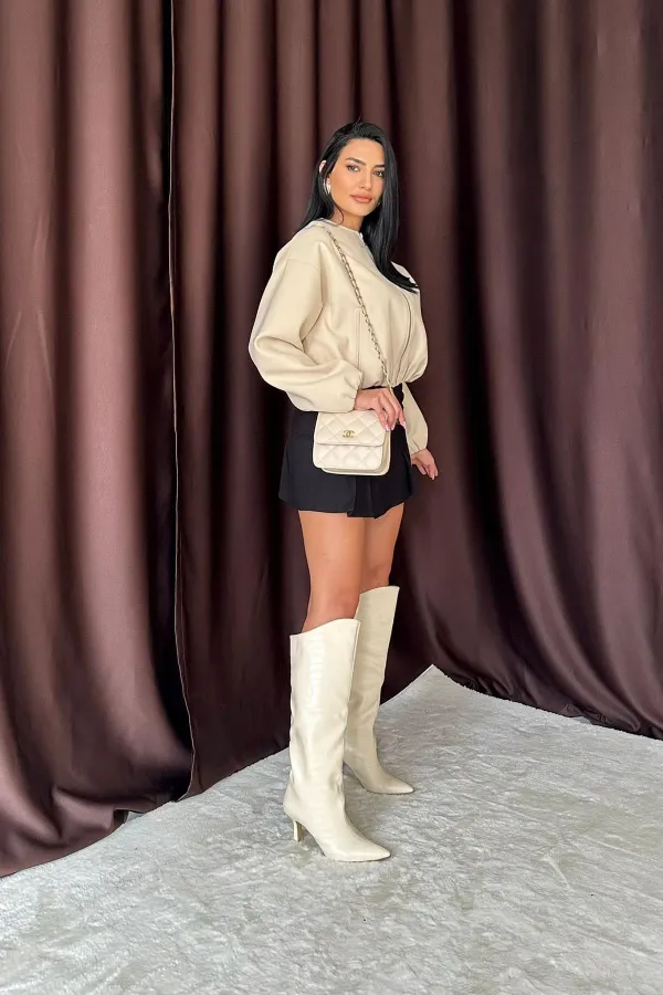 Jupe plissée noire à boutons en gros