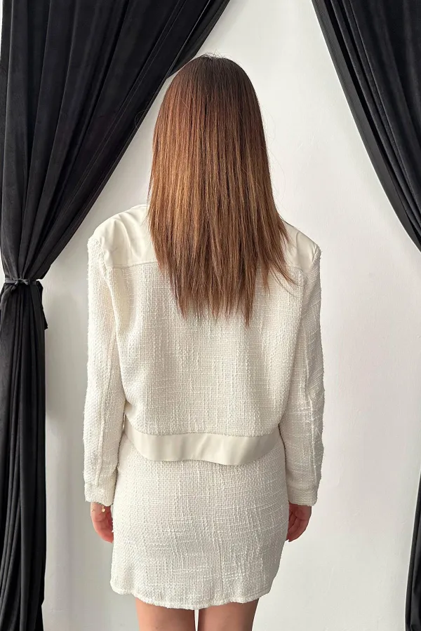 Ensemble veste et pantalon garnis de cuir triple écru en gros