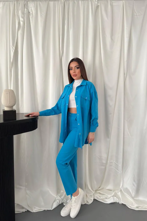 Ensemble chemise bleue et pantalon à pression en gros