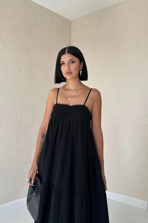 Robe en mousseline noire à bretelles en gros