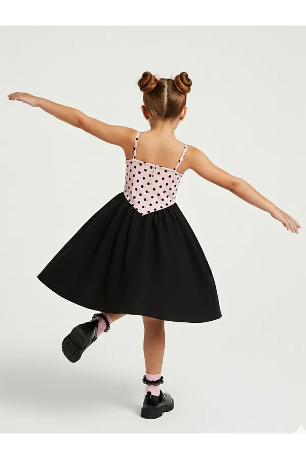 Robe de fille à pois roses et noirs