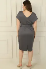 Front and back V-neck, belted waist, lined plus-size dress.