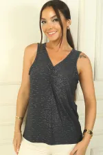 Blouse à col en V froncée sur le devant en lycra pailleté