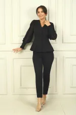 Two-piece set with chiffon sleeves and beaded shoulders.