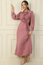 Long dress with half-button front, ribbed detail, and belted waist.