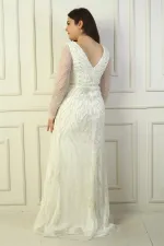 Robe longue grande taille à décolleté en V devant et dos, manches en tulle, doublée et ornée